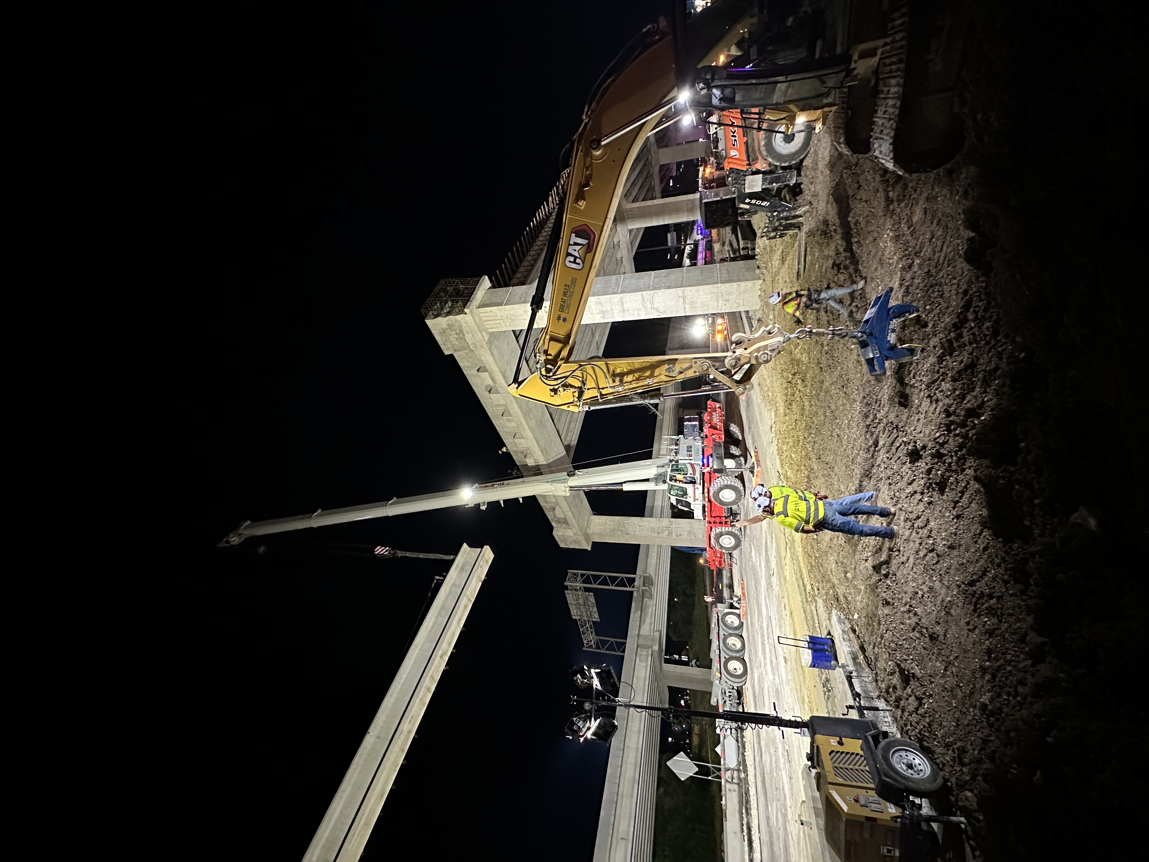 Setting precast girder beams on Bridge 12 between Bents 8 and 9. 